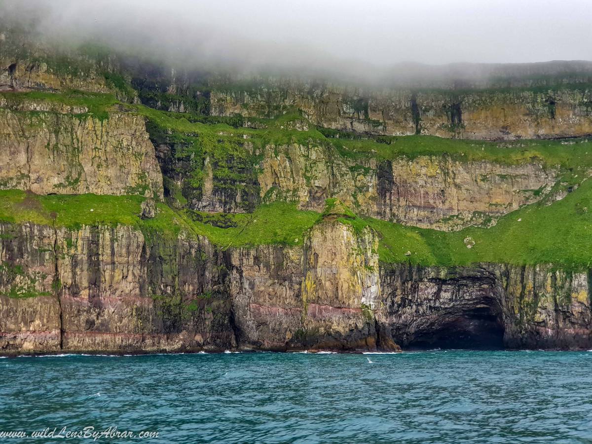 Impressive views of cliffs from the ferry to Mykines