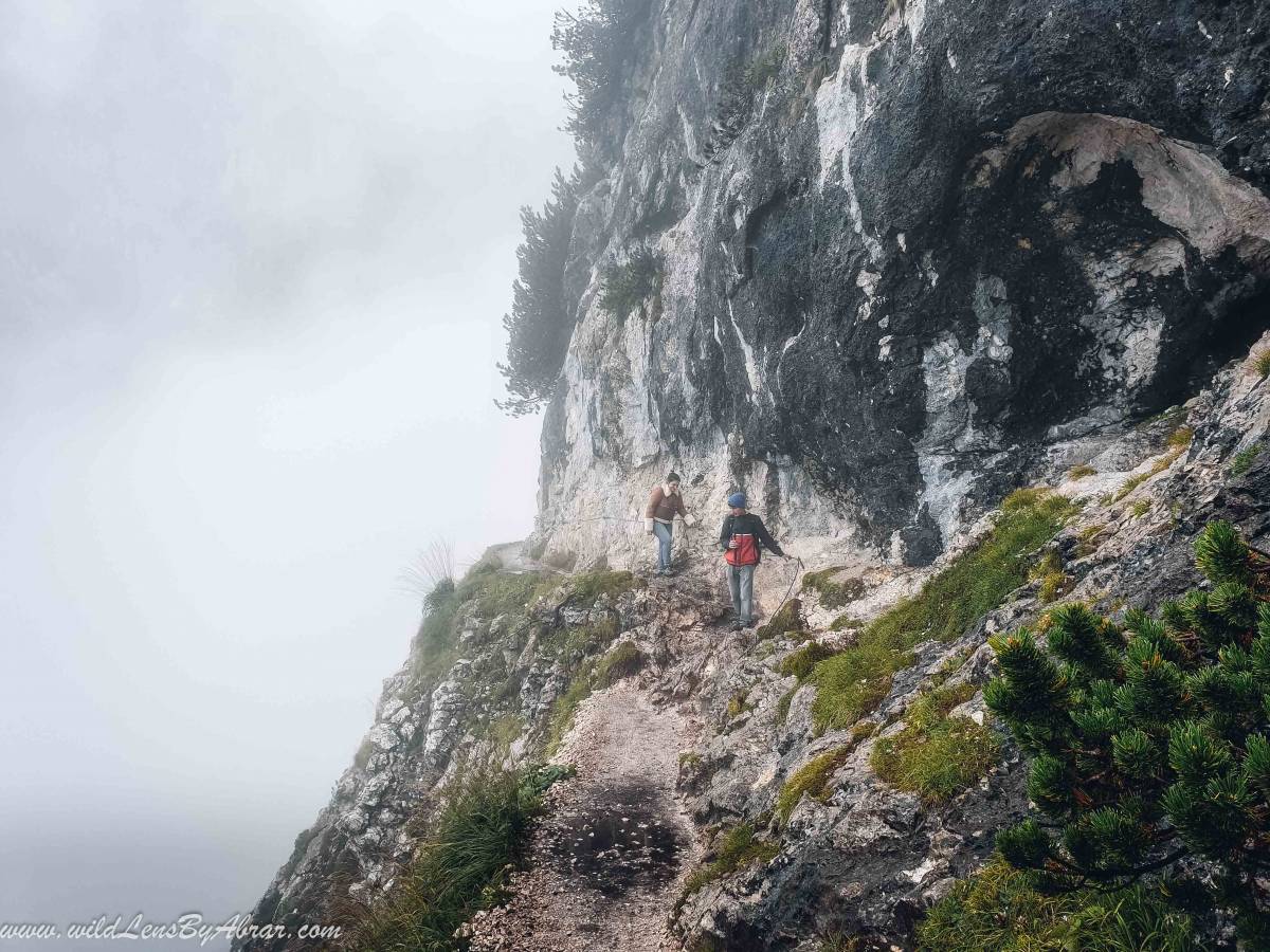 The exposed ridge is secured with ropes for the safety of the hikers